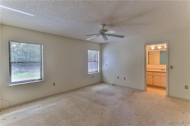 5618 W Hesse Ct, Homosassa, FL 34448 - empty room with ceiling fan, baseboards, a textured ceiling, and light colored carpet