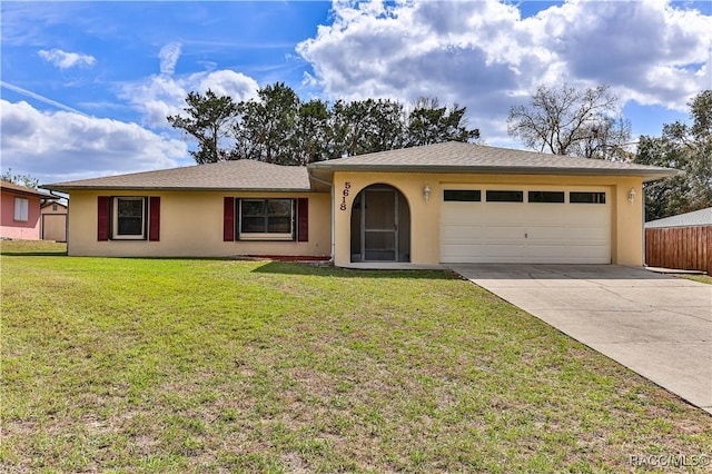 ranch-style house with concrete driveway, a front lawn, an attached garage, and stucco siding