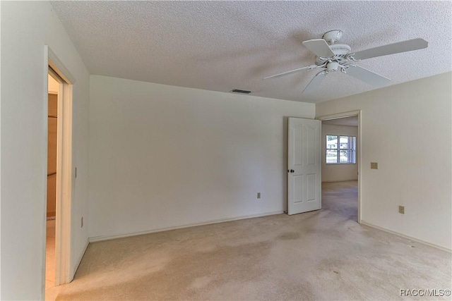 5618 W Hesse Ct, Homosassa, FL 34448 - unfurnished room featuring light carpet, a textured ceiling, visible vents, and a ceiling fan