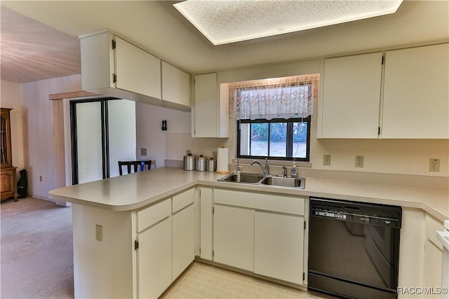 5618 W Hesse Ct, Homosassa, FL 34448 - kitchen with black dishwasher, light countertops, a sink, and a peninsula