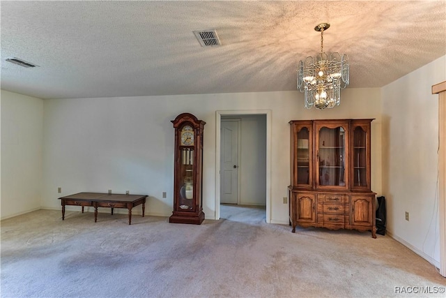 5618 W Hesse Ct, Homosassa, FL 34448 - interior space with a chandelier, carpet floors, a textured ceiling, and visible vents
