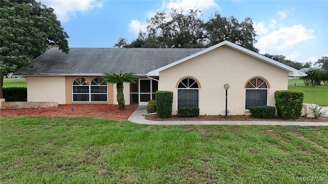 640 E Hartford St, Hernando, FL 34442 - ranch-style home featuring a front yard, stucco siding, and roof with shingles