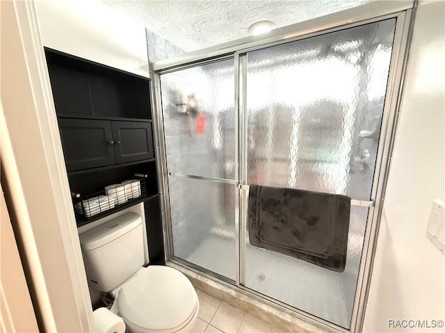 640 E Hartford St, Hernando, FL 34442 - bathroom with a stall shower, tile patterned flooring, and a textured ceiling