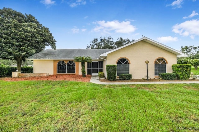 640 E Hartford St, Hernando, FL 34442 - ranch-style house with a front lawn and brick siding