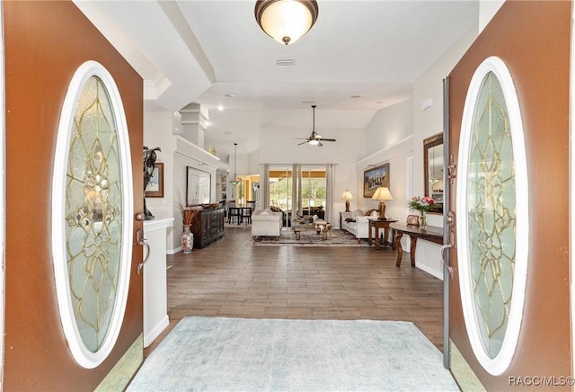 entryway featuring ceiling fan, wood-type flooring, and high vaulted ceiling