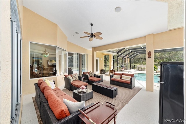 view of patio / terrace with an outdoor living space and glass enclosure