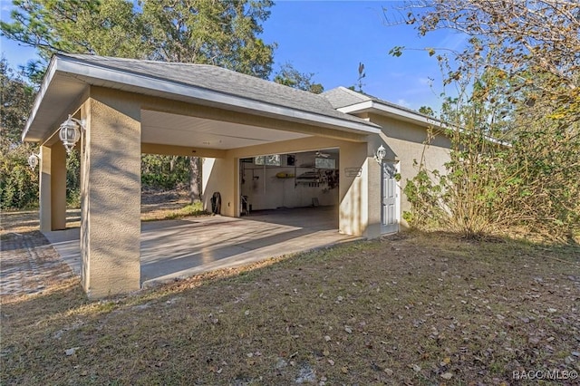 view of vehicle parking with a carport