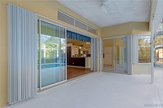 interior space with a patio area and ceiling fan