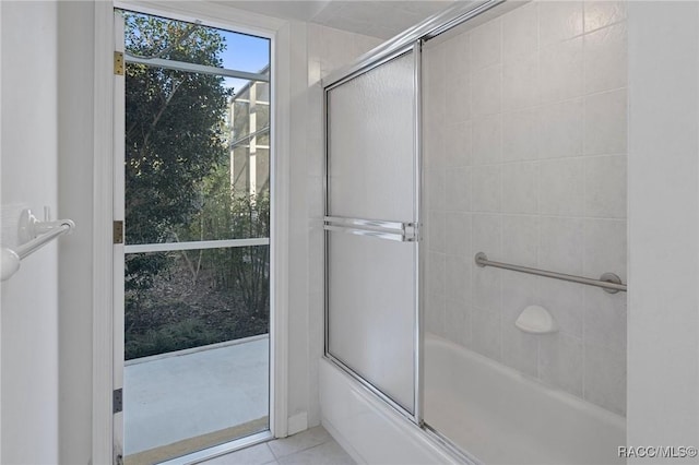 bathroom with enclosed tub / shower combo and tile patterned flooring