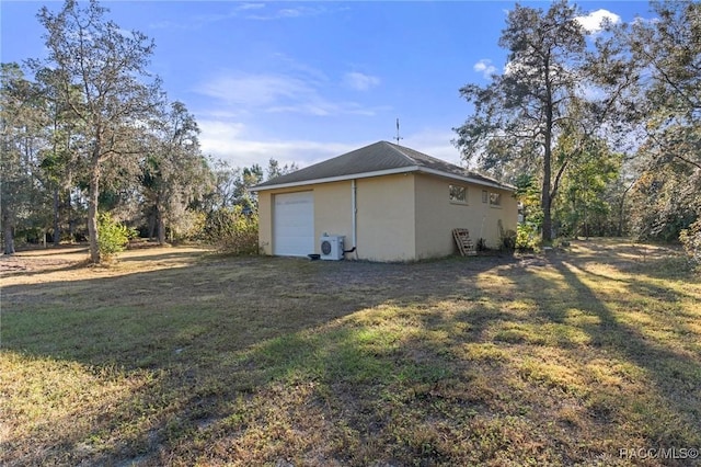 view of property exterior featuring a garage and a lawn