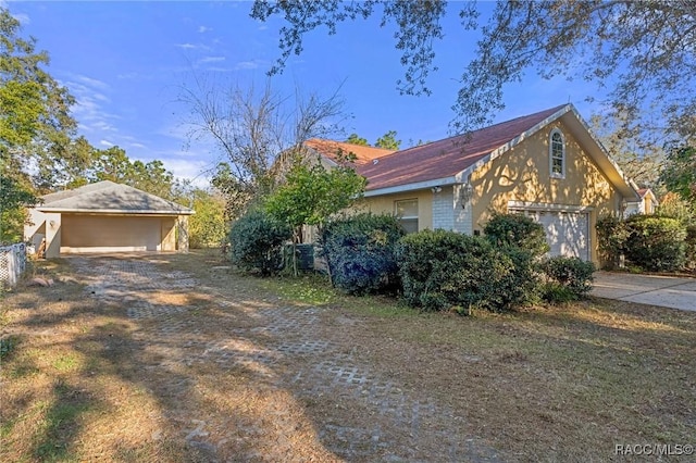 view of side of property with a garage