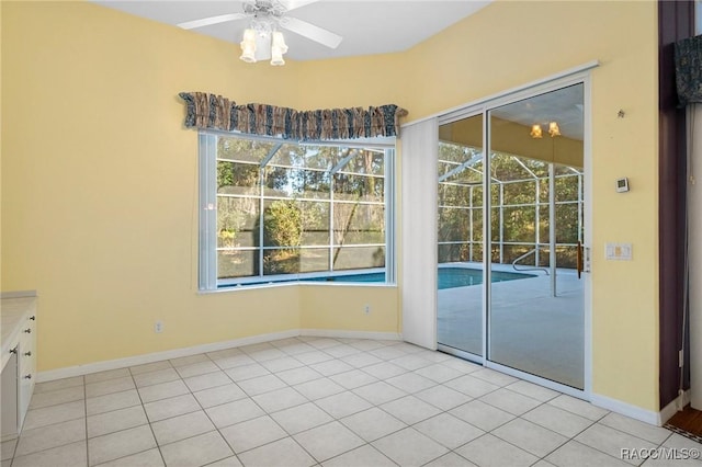 unfurnished dining area with light tile patterned flooring and ceiling fan