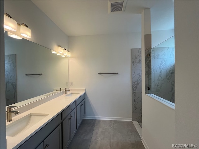 bathroom featuring vanity and tiled shower