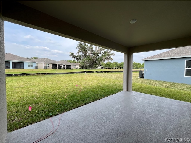 view of yard featuring a patio and central AC unit