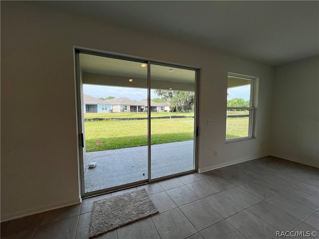 entryway featuring light tile patterned floors and a wealth of natural light