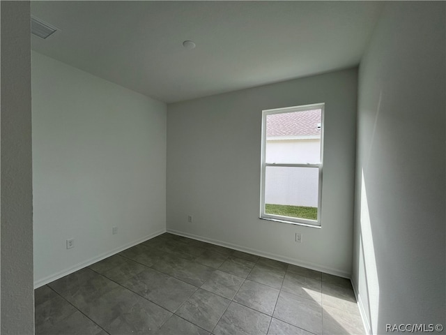 view of tiled spare room