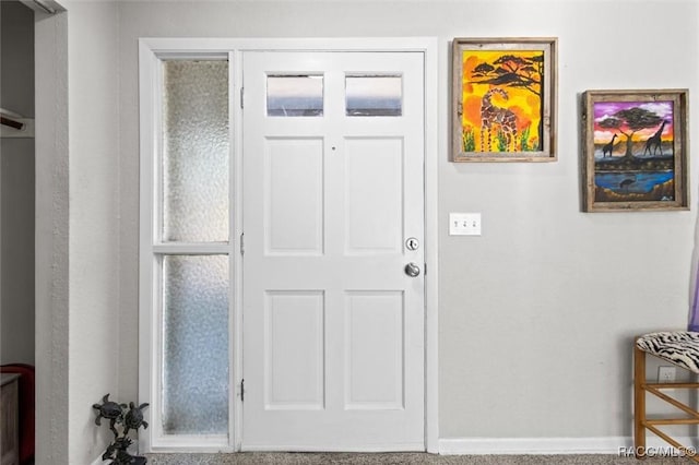 view of carpeted entrance foyer