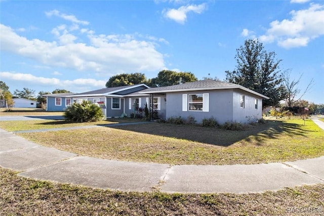 ranch-style home featuring a front lawn