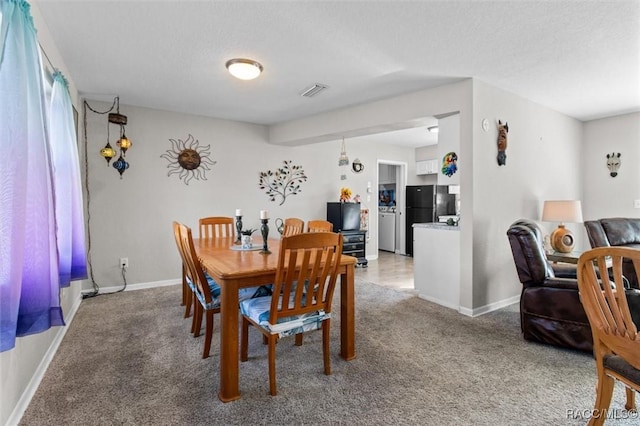 dining room featuring carpet