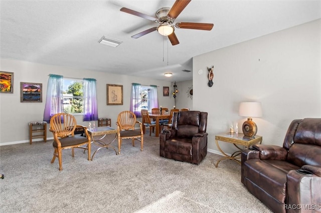 carpeted living room featuring ceiling fan