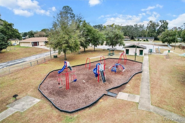 view of community with a playground and a yard