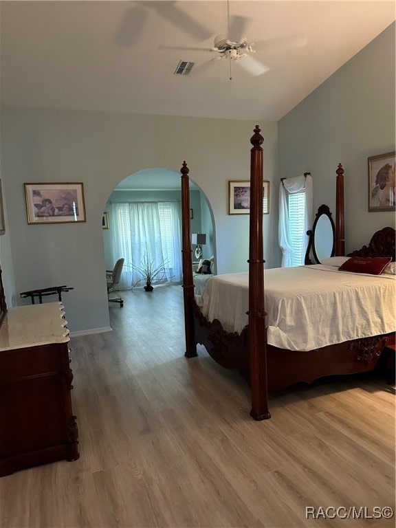 bedroom with hardwood / wood-style flooring and ceiling fan