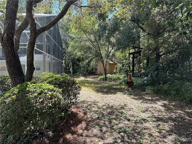 view of yard featuring a lanai