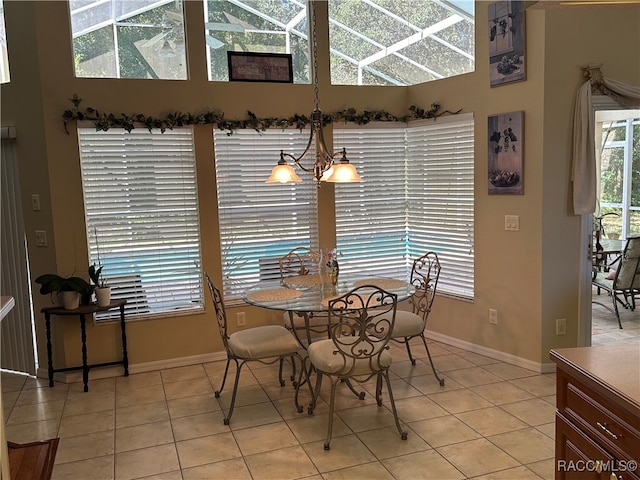 dining room with a notable chandelier and light tile patterned flooring