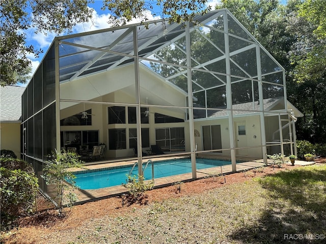 back of property with a lanai and a patio