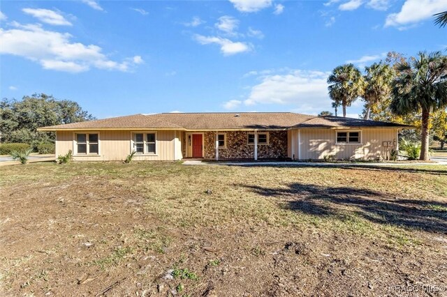 ranch-style house with a front yard