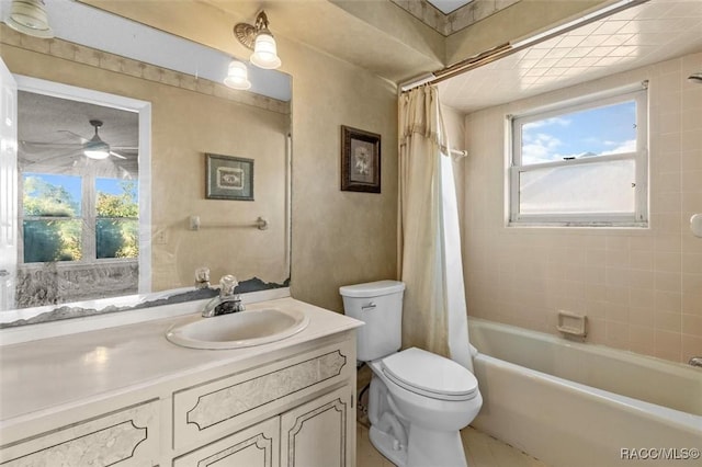 full bathroom with shower / bath combo, vanity, toilet, and ceiling fan