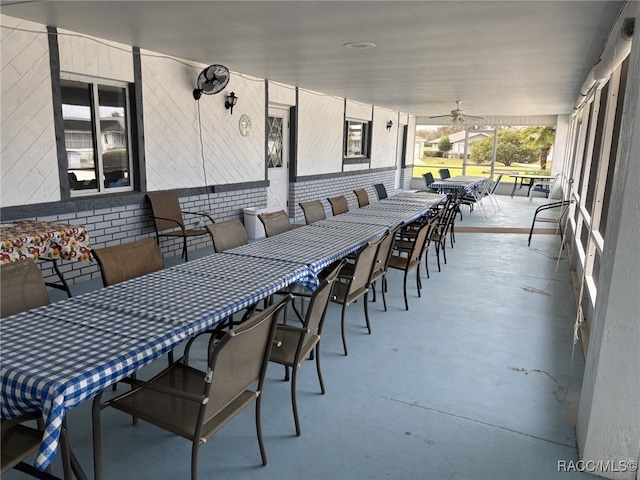 view of patio / terrace featuring outdoor dry bar and a ceiling fan