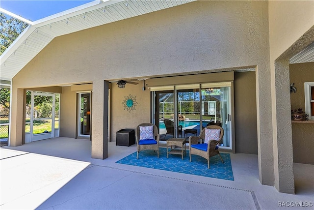 view of patio / terrace featuring glass enclosure