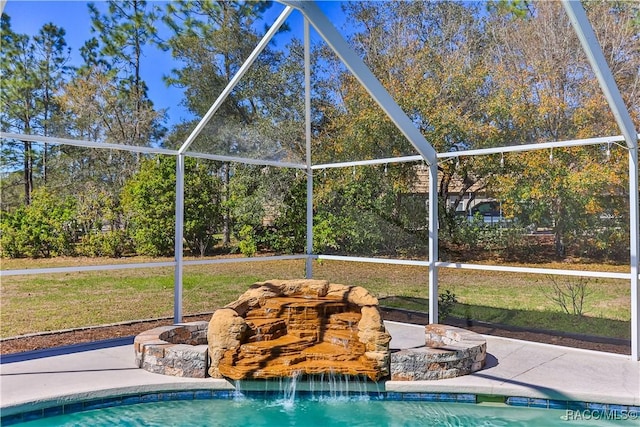 view of pool with a lanai and a patio