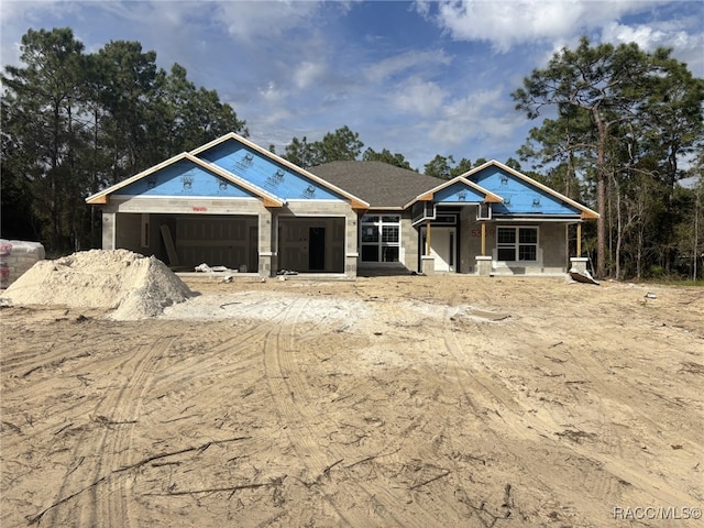 property in mid-construction with a garage