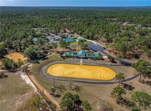 birds eye view of property with a forest view