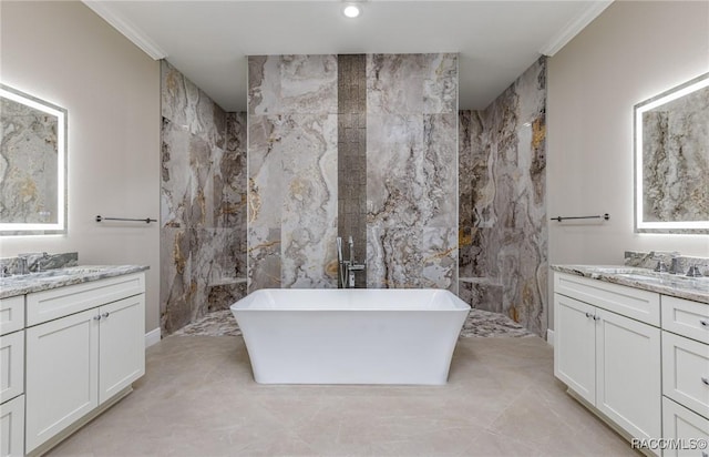 full bathroom featuring a freestanding tub, tile walls, ornamental molding, and two vanities