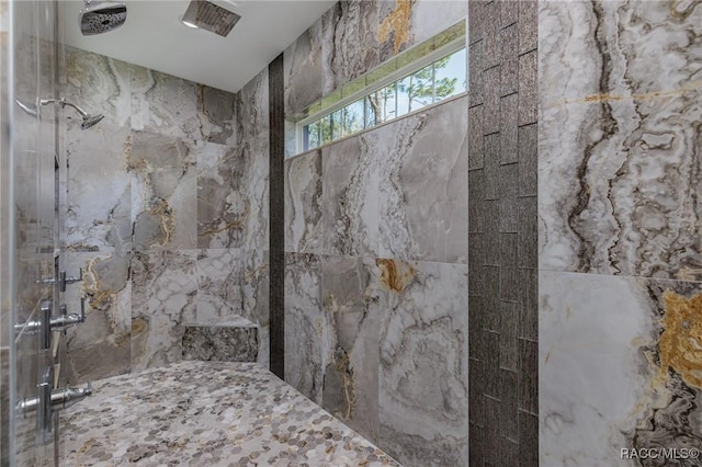 full bathroom featuring tiled shower