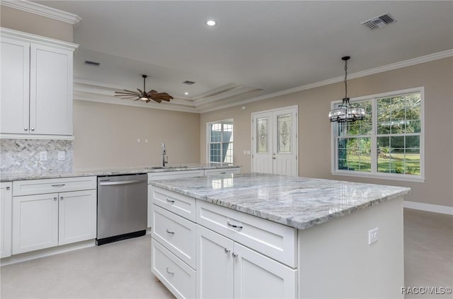 kitchen featuring dishwasher, visible vents, and ornamental molding