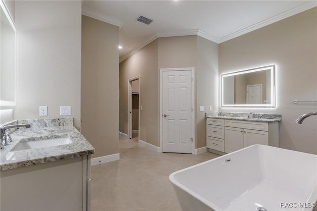 bathroom featuring visible vents, baseboards, ornamental molding, two vanities, and a sink