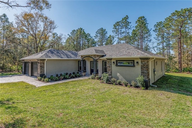 ranch-style house with driveway, stucco siding, a front lawn, a garage, and stone siding