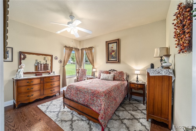 bedroom featuring ceiling fan and dark hardwood / wood-style flooring