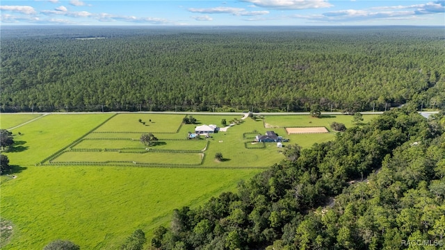 birds eye view of property with a rural view