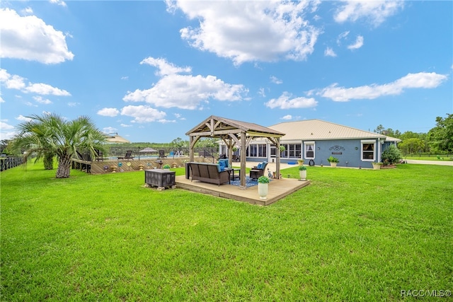 back of house with a gazebo and a yard