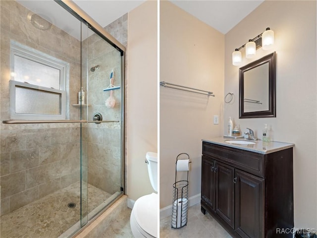 bathroom with tile patterned flooring, vanity, toilet, and an enclosed shower