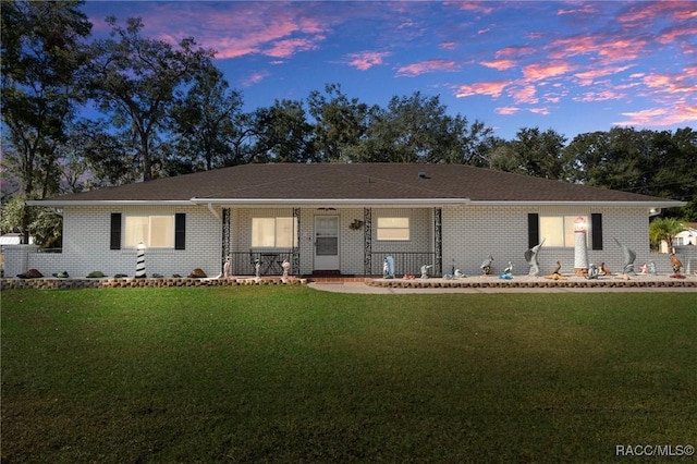 ranch-style house featuring a yard