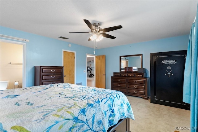 carpeted bedroom featuring a closet, a spacious closet, and ceiling fan