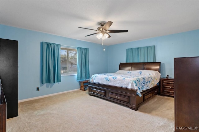 carpeted bedroom with ceiling fan