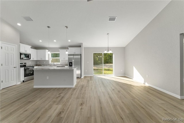 9065 N Arcadia Way, Citrus Springs, FL 34434 - kitchen with white cabinetry, open floor plan, visible vents, and appliances with stainless steel finishes