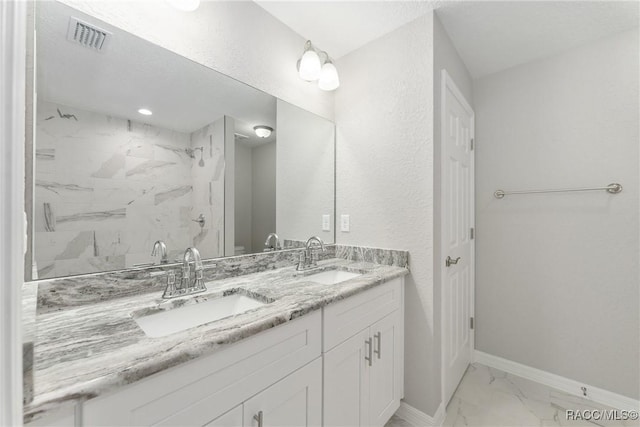 9065 N Arcadia Way, Citrus Springs, FL 34434 - full bathroom featuring marble look tiles, tiled shower, double vanity, and baseboards